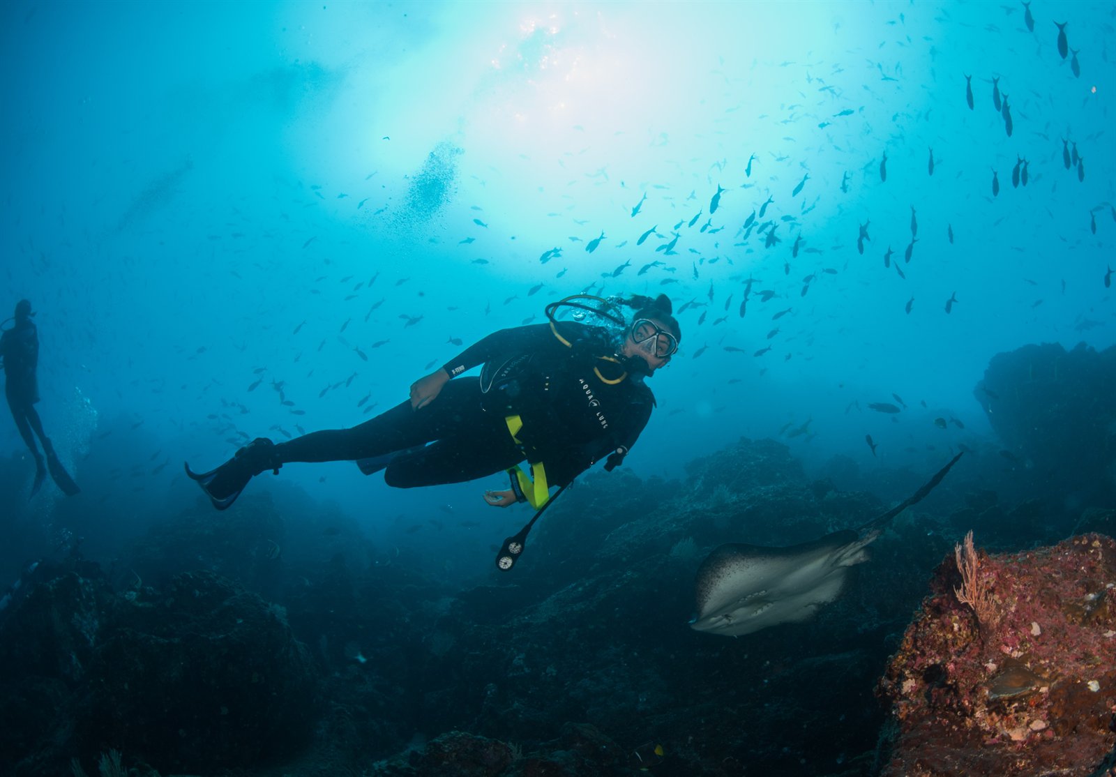 Diver enjoying a first ocean dive in clear water off Tamarindo