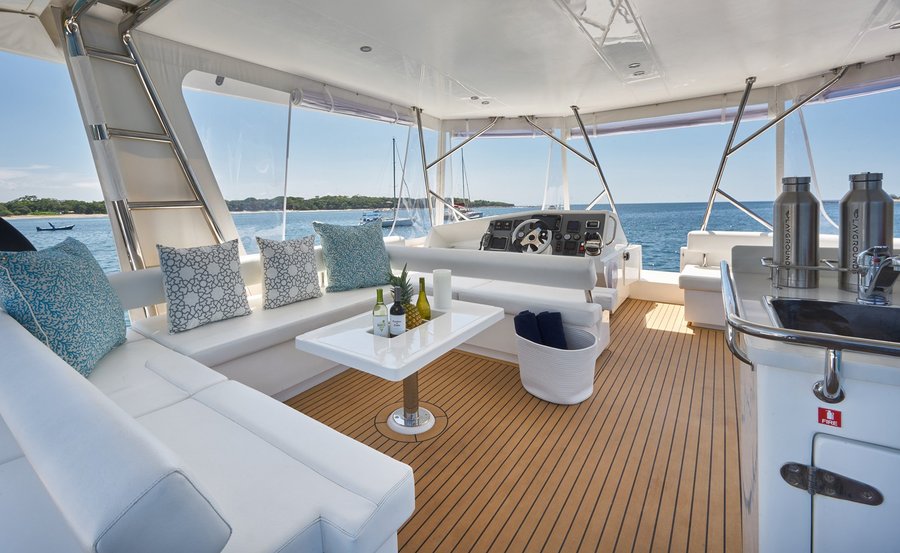 Flybridge lounge and helm of the Playgrounds catamaran, Tamarindo, Costa Rica